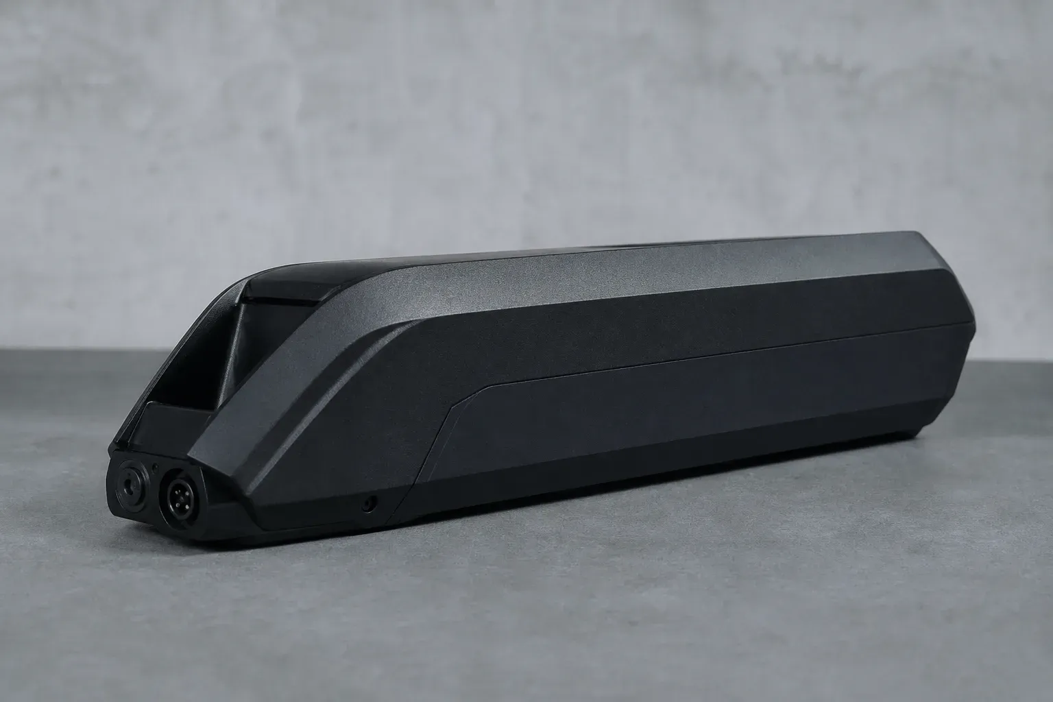 Close documentary still of an e-bike battery pack on a clean display surface